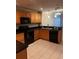 Updated kitchen featuring wooden cabinets, modern appliances, and ample counter space at 831 N Fern Creek Ave # 101, Orlando, FL 32803