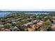 An aerial view of a neighborhood with lush greenery and waterfront access, showcasing a desirable community at 8912 Heritage Bay Cir, Orlando, FL 32836