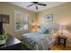 Comfortable bedroom features natural light, a bedside table, and carpet flooring at 8912 Heritage Bay Cir, Orlando, FL 32836