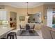 Open dining area connected to the kitchen with a view of the pool area through a large bay window at 8912 Heritage Bay Cir, Orlando, FL 32836