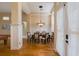 Elegant dining room with high ceilings, hardwood floors and stylish lighting fixture at 8912 Heritage Bay Cir, Orlando, FL 32836