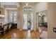 Bright foyer with hardwood floors, high ceilings, and views into the living room and dining area at 8912 Heritage Bay Cir, Orlando, FL 32836