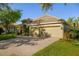 Attractive home exterior featuring a brick driveway and a convenient attached two-car garage at 8912 Heritage Bay Cir, Orlando, FL 32836