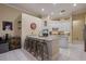 Contemporary kitchen with granite countertops, stainless steel appliances, and a convenient island with barstool seating at 8912 Heritage Bay Cir, Orlando, FL 32836