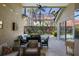Inviting lanai provides a relaxing space with a ceiling fan, outdoor seating, and view of the pool at 8912 Heritage Bay Cir, Orlando, FL 32836