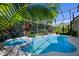 Beautiful pool and spa area surrounded by lush landscaping and a screened enclosure, perfect for relaxation at 8912 Heritage Bay Cir, Orlando, FL 32836