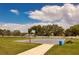 Community basketball court is complete with picnic tables and trashcans at 935 Gloucester Court, Kissimmee, FL 34758