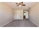 Bright bedroom with neutral walls, carpet flooring, ceiling fan, closet and an ensuite bathroom at 935 Gloucester Court, Kissimmee, FL 34758