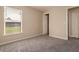 Bright bedroom featuring neutral walls, carpet floors, a window and two closets for extra storage at 935 Gloucester Court, Kissimmee, FL 34758