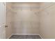 Walk-in closet with carpet floors and ample wire shelving provides plenty of storage space at 935 Gloucester Court, Kissimmee, FL 34758