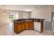 Bright kitchen with a breakfast bar that opens up to the living area at 935 Gloucester Court, Kissimmee, FL 34758