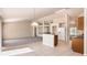 Open-concept kitchen with tile floors and breakfast bar overlooks a spacious living area, great for entertaining at 935 Gloucester Court, Kissimmee, FL 34758