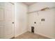 Well-lit laundry room with tile flooring, shelving and hookups for washer and dryer at 935 Gloucester Court, Kissimmee, FL 34758