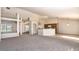 Open concept living and kitchen area with high ceilings and a breakfast bar at 935 Gloucester Court, Kissimmee, FL 34758