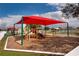 Bright, colorful playground with slides and covered seating for community enjoyment at 935 Gloucester Court, Kissimmee, FL 34758