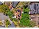 Aerial view of a home with solar panels, emphasizing sustainable living surrounded by green trees at 10400 Hunters Trail Ct, Orlando, FL 32817