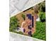 Aerial shot displays a home with solar panels, framed against an abstract backdrop at 10400 Hunters Trail Ct, Orlando, FL 32817