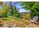 Private backyard space with lush greenery and a tranquil seating area, perfect for relaxation at 10400 Hunters Trail Ct, Orlando, FL 32817