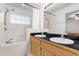 Bathroom featuring double sinks, a tub, and shower at 10400 Hunters Trail Ct, Orlando, FL 32817