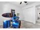 Bedroom featuring musical equipment and white closet doors with updated lighting at 10400 Hunters Trail Ct, Orlando, FL 32817