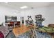 Bright dining area with high ceilings, wooden floors, seamlessly connected to living spaces at 10400 Hunters Trail Ct, Orlando, FL 32817