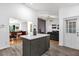 Kitchen island with drawers and cabinet space sits between dining and living areas at 10400 Hunters Trail Ct, Orlando, FL 32817