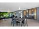 Inviting covered patio with outdoor dining set and screened-in areas, perfect for entertaining at 10400 Hunters Trail Ct, Orlando, FL 32817
