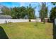 Fenced backyard with green grass and storage shed at 1103 Timor Ave, Orlando, FL 32804