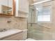 Bathroom with a glass-enclosed shower, grab bars, and a vanity with countertop space at 1103 Timor Ave, Orlando, FL 32804