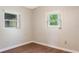 Cozy bedroom with vinyl floors and two windows providing natural light, perfect for rest and relaxation at 1103 Timor Ave, Orlando, FL 32804