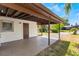 Covered patio features concrete floor, support columns, and access to backyard at 1103 Timor Ave, Orlando, FL 32804