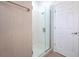 Modern bathroom featuring a glass-enclosed shower with white tile and chrome fixtures at 113 Golden Crest Ct, Winter Springs, FL 32708
