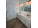Bathroom boasts double sinks, quartz counters, modern fixtures, and neutral tones at 113 Golden Crest Ct, Winter Springs, FL 32708
