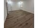 The bedroom features hardwood floors and a window that allows ample natural light at 113 Golden Crest Ct, Winter Springs, FL 32708