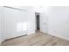 This bedroom has wood floors, an open door, and a bi-fold door closet at 113 Golden Crest Ct, Winter Springs, FL 32708