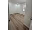 Bright bedroom featuring wood floors and natural light from the shuttered window at 113 Golden Crest Ct, Winter Springs, FL 32708