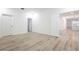 A bright bedroom boasts wood floors and crisp white trim throughout at 113 Golden Crest Ct, Winter Springs, FL 32708