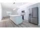 Modern kitchen featuring a large island, stainless steel appliances, and open layout for entertaining and cooking at 113 Golden Crest Ct, Winter Springs, FL 32708