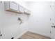 Bright laundry room with built-in cabinets and washer/dryer hookups at 113 Golden Crest Ct, Winter Springs, FL 32708