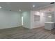 Bright open-concept living room featuring wood flooring, recessed lighting, and access to the kitchen at 113 Golden Crest Ct, Winter Springs, FL 32708
