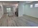 Open-concept floor plan with sleek flooring connecting the living room and kitchen, with lots of natural light at 113 Golden Crest Ct, Winter Springs, FL 32708