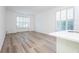 Bright living room with sleek floors, and large windows providing natural light and neighborhood views at 113 Golden Crest Ct, Winter Springs, FL 32708