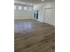 Spacious living room with wood flooring, abundant natural light, and double door entryway at 113 Golden Crest Ct, Winter Springs, FL 32708