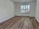 Bright living room with sleek floors, and large windows providing natural light and neighborhood views at 113 Golden Crest Ct, Winter Springs, FL 32708