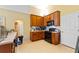 Functional kitchen with wood cabinets and black appliances at 1234 1St Ave, Deland, FL 32724