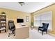Cozy home office with desk, chair, shelves, and window at 1234 1St Ave, Deland, FL 32724