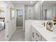 Well-lit bathroom with double vanity, modern fixtures, and a glass-enclosed shower at 1287 Tarflower Dr, Winter Springs, FL 32708