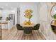 Chic dining area with a round table, stylish chairs, and decorative wall art at 1287 Tarflower Dr, Winter Springs, FL 32708