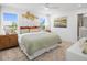 Bright main bedroom with large windows, decorative wall art, and comfortable furnishings at 1287 Tarflower Dr, Winter Springs, FL 32708