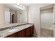 Bathroom features a granite countertop with dual sinks, and a well-maintained shower area at 1304 Independence Ln, Mount Dora, FL 32757